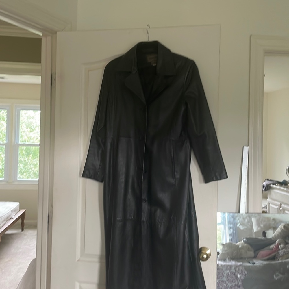 Long black leather coat. Lined. Trendy.